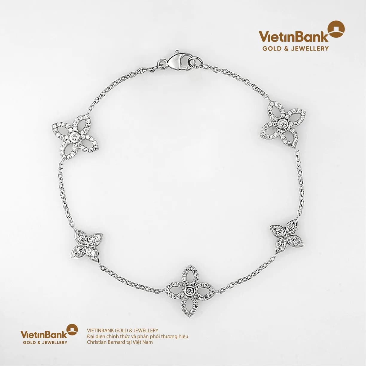 Lắc vàng trắng 18K (4.893) gắn Kim Cương (0.685)